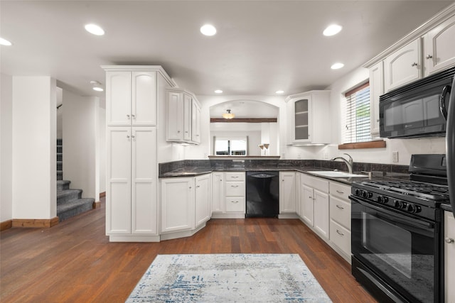 443 Karrow Ave, Whitefish, MT 59937 - kitchen with black appliances, dark countertops, white cabinets, recessed lighting, and dark wood finished floors