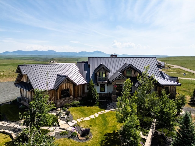 155 Peacemaker Rdg, Belt, MT 59412 - view of front of property featuring a standing seam roof, a metal roof, stone siding, and a chimney