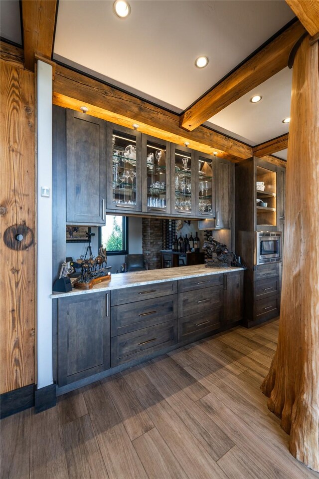 155 Peacemaker Rdg, Belt, MT 59412 - bar area with beam ceiling, stainless steel microwave, dark wood-style floors, and recessed lighting