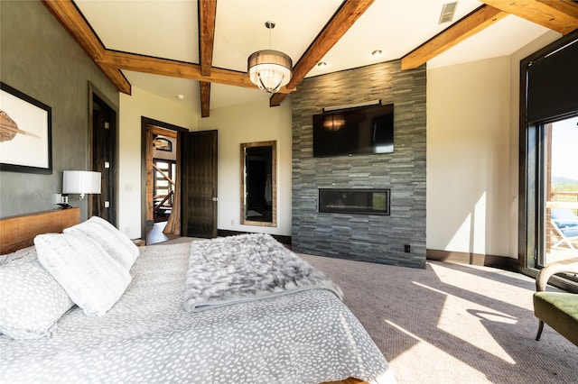 155 Peacemaker Rdg, Belt, MT 59412 - carpeted bedroom with beam ceiling and a large fireplace