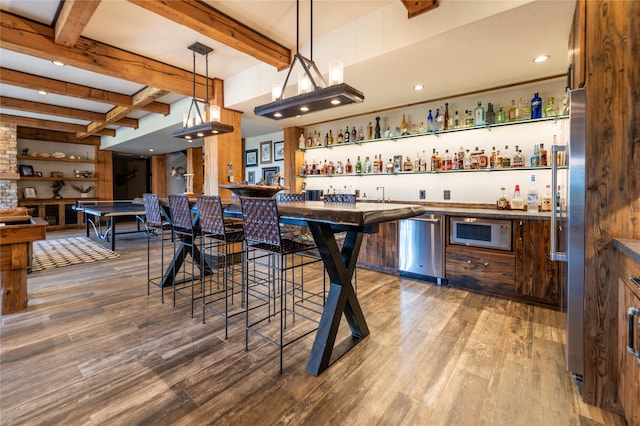 155 Peacemaker Rdg, Belt, MT 59412 - indoor wet bar with stainless steel appliances, beam ceiling, wood finished floors, hanging light fixtures, and recessed lighting