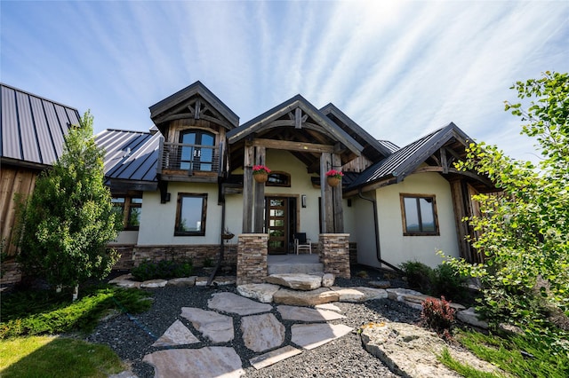 155 Peacemaker Rdg, Belt, MT 59412 - craftsman-style house featuring a standing seam roof, stucco siding, a metal roof, and stone siding