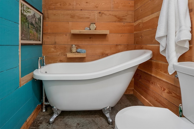 983 Lake Dr, Columbia Falls, MT 59912 - full bathroom with wood walls and a freestanding bath