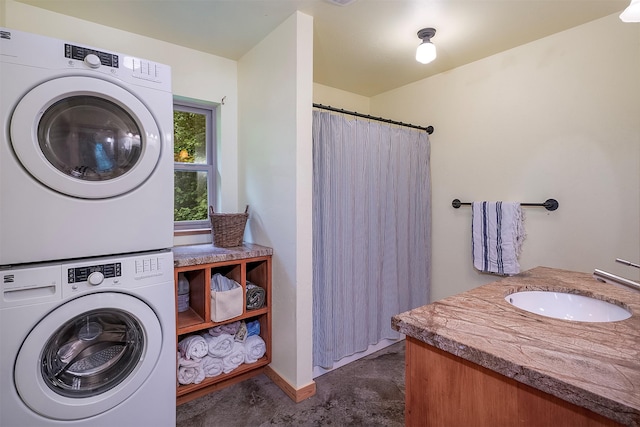983 Lake Dr, Columbia Falls, MT 59912 - laundry area with stacked washing machine and dryer and baseboards