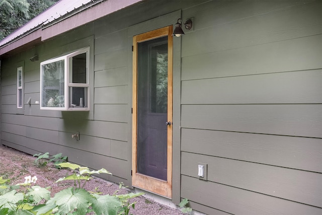 983 Lake Dr, Columbia Falls, MT 59912 - entrance to property featuring a metal roof