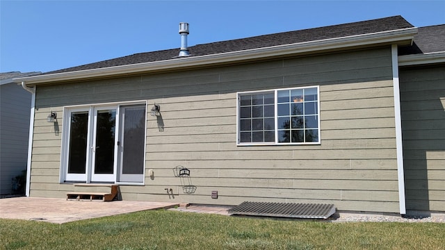 209 E Nicklaus Ave, Kalispell, MT 59901 - back of house with a patio, a yard, and entry steps