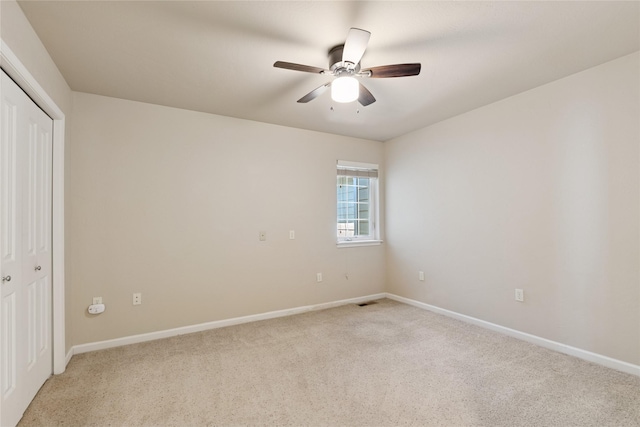 209 E Nicklaus Ave, Kalispell, MT 59901 - unfurnished bedroom featuring light carpet, a closet, and a ceiling fan