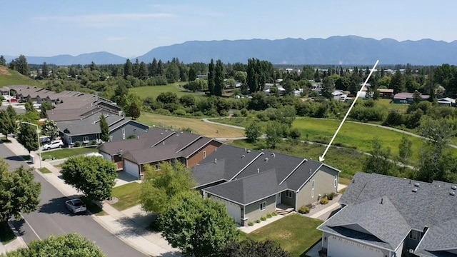 209 E Nicklaus Ave, Kalispell, MT 59901 - aerial perspective of suburban area featuring a mountainous background