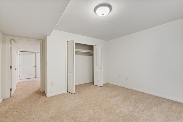 209 E Nicklaus Ave, Kalispell, MT 59901 - unfurnished bedroom with carpet flooring, a closet, and a textured ceiling