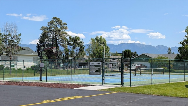 209 E Nicklaus Ave, Kalispell, MT 59901 - view of basketball court featuring a mountain view, community basketball court, and a gate