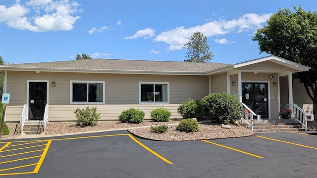 209 E Nicklaus Ave, Kalispell, MT 59901 - view of front of home featuring uncovered parking and a shingled roof