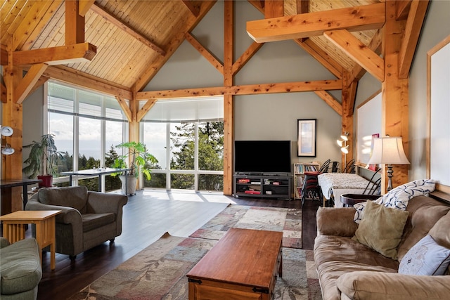 100 Deep Bay Dr, Lakeside, MT 59922 - living area with high vaulted ceiling, healthy amount of natural light, wood finished floors, and beamed ceiling
