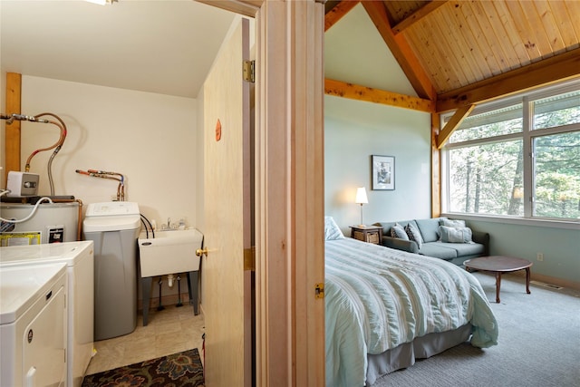 100 Deep Bay Dr, Lakeside, MT 59922 - bedroom featuring washing machine and clothes dryer, water heater, beam ceiling, and high vaulted ceiling