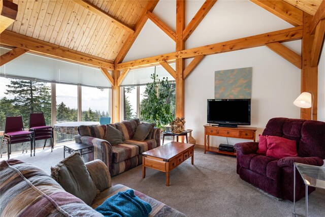 100 Deep Bay Dr, Lakeside, MT 59922 - carpeted living room featuring beamed ceiling and high vaulted ceiling