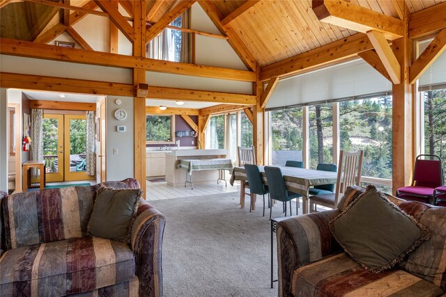 100 Deep Bay Dr, Lakeside, MT 59922 - living room with french doors, high vaulted ceiling, carpet, and beam ceiling