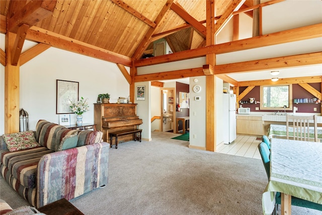 100 Deep Bay Dr, Lakeside, MT 59922 - carpeted living area with high vaulted ceiling and a wood ceiling with exposed beams