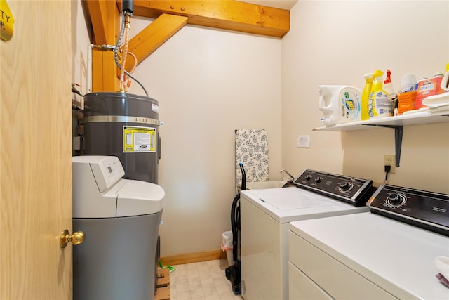 100 Deep Bay Dr, Lakeside, MT 59922 - washroom with electric water heater, washing machine and clothes dryer, and light floors
