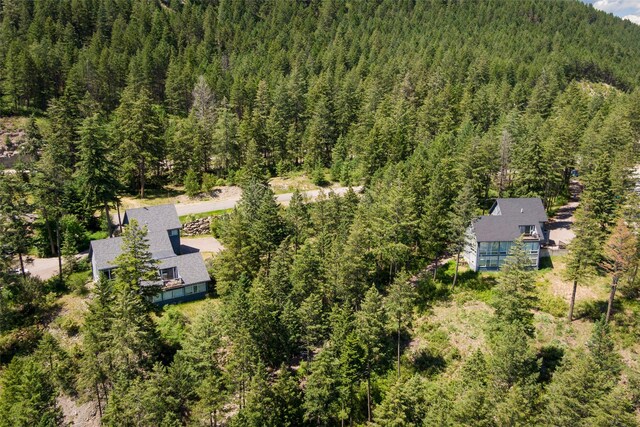 100 Deep Bay Dr, Lakeside, MT 59922 - view from above of property featuring a heavily wooded area