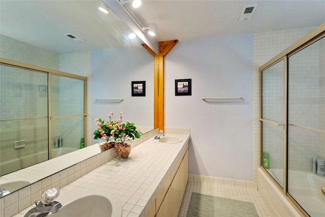 100 Deep Bay Dr, Lakeside, MT 59922 - full bathroom with tile patterned flooring, enclosed tub / shower combo, and double vanity