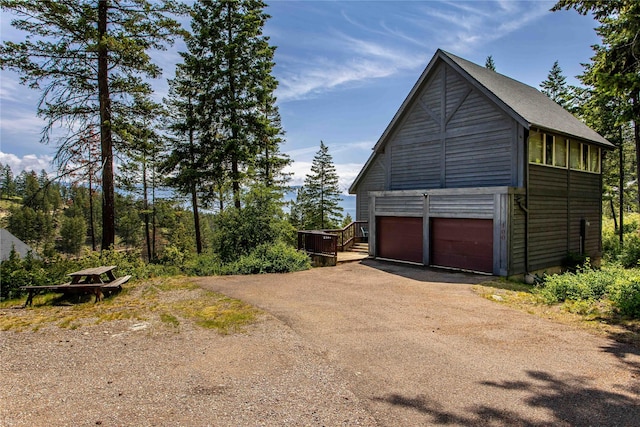 100 Deep Bay Dr, Lakeside, MT 59922 - view of side of property with asphalt driveway