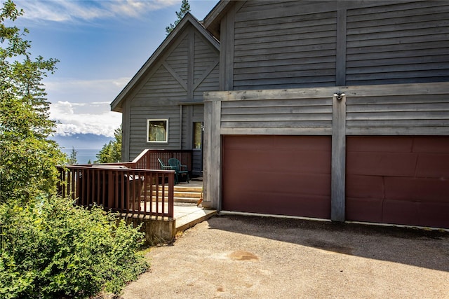 100 Deep Bay Dr, Lakeside, MT 59922 - view of front of house featuring a garage and driveway