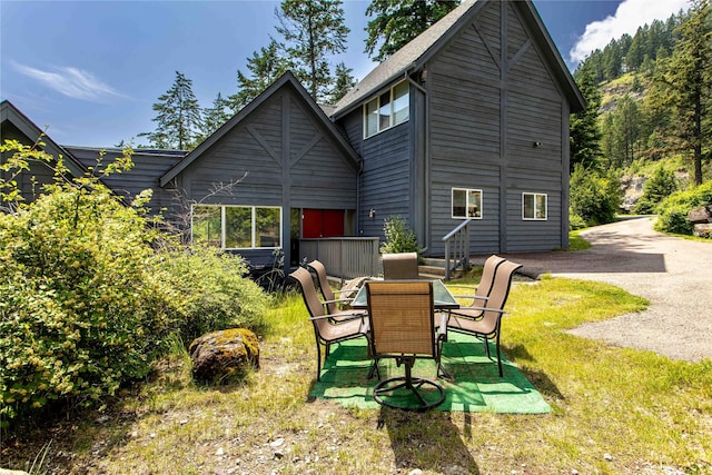 100 Deep Bay Dr, Lakeside, MT 59922 - rear view of house with a yard and a patio