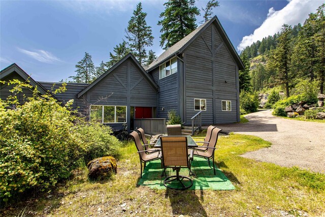 100 Deep Bay Dr, Lakeside, MT 59922 - rear view of house with a lawn