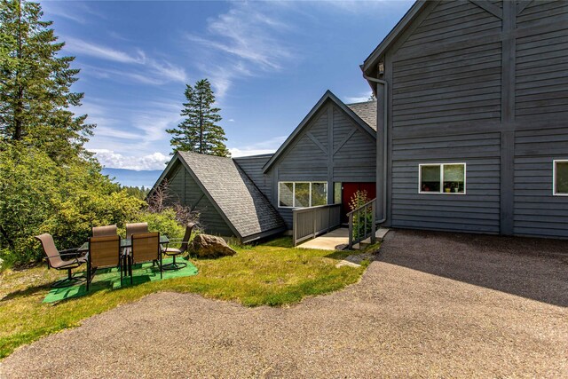 100 Deep Bay Dr, Lakeside, MT 59922 - back of house featuring a patio area and outdoor dining space