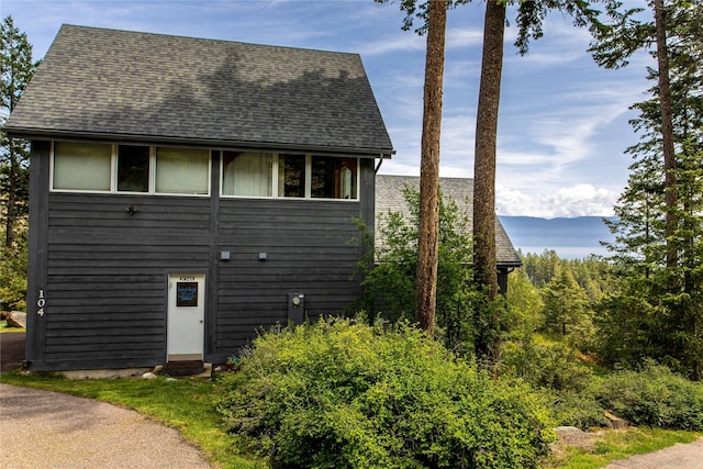 100 Deep Bay Dr, Lakeside, MT 59922 - view of side of property with roof with shingles