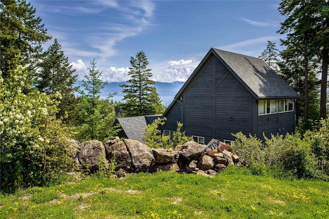 100 Deep Bay Dr, Lakeside, MT 59922 - view of property exterior featuring roof with shingles