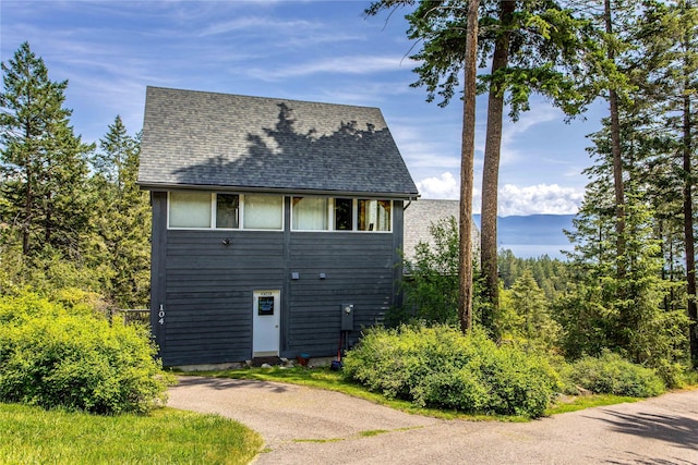 100 Deep Bay Dr, Lakeside, MT 59922 - view of front of home featuring roof with shingles