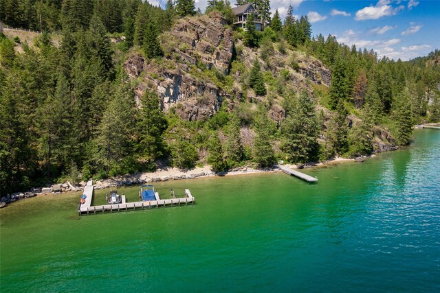 100 Deep Bay Dr, Lakeside, MT 59922 - drone / aerial view of a nearby body of water and a heavily wooded area