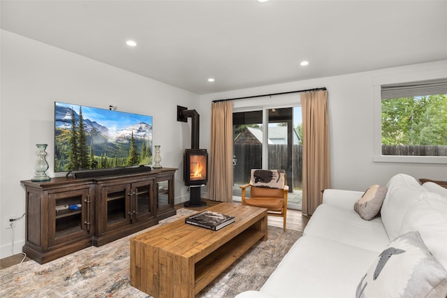 441/443 Karrow Ave, Whitefish, MT 59937 - living room with a wood stove, wood finished floors, plenty of natural light, and recessed lighting