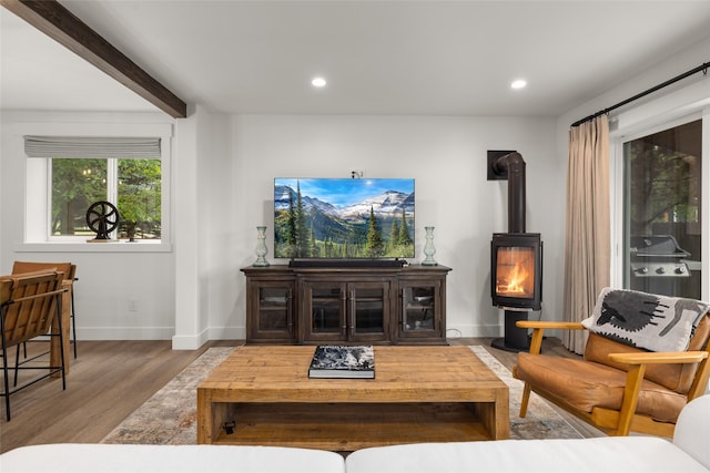 441/443 Karrow Ave, Whitefish, MT 59937 - living area with wood finished floors, a wood stove, recessed lighting, and beamed ceiling