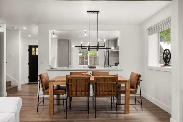 441/443 Karrow Ave, Whitefish, MT 59937 - dining area with recessed lighting, wood finished floors, a chandelier, and stairway
