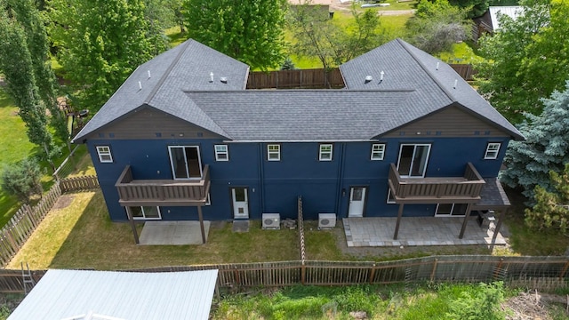 441/443 Karrow Ave, Whitefish, MT 59937 - back of property featuring a patio area, a shingled roof, a fenced backyard, stucco siding, and a wooden deck