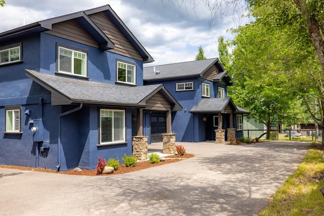441/443 Karrow Ave, Whitefish, MT 59937 - craftsman-style home featuring stucco siding, a shingled roof, and driveway