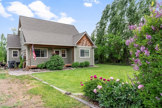 5014 Eastside Hwy, Stevensville, MT 59870 - view of front facade with roof with shingles and a front yard