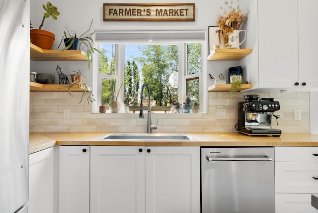 5014 Eastside Hwy, Stevensville, MT 59870 - kitchen featuring open shelves, stainless steel dishwasher, and tasteful backsplash
