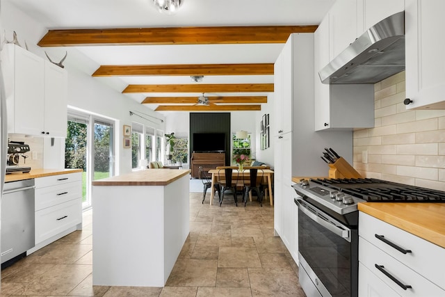 5014 Eastside Hwy, Stevensville, MT 59870 - kitchen with wooden counters, appliances with stainless steel finishes, extractor fan, ceiling fan, and tasteful backsplash