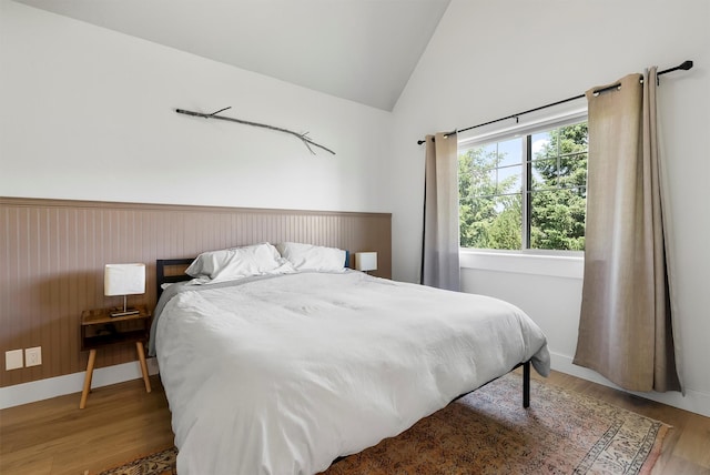 5014 Eastside Hwy, Stevensville, MT 59870 - bedroom featuring vaulted ceiling and wood finished floors