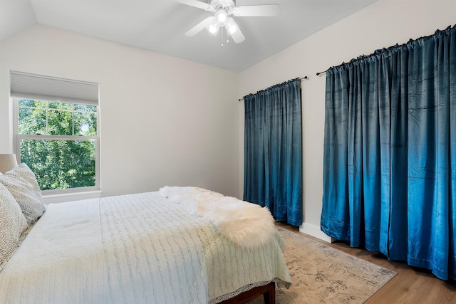 5014 Eastside Hwy, Stevensville, MT 59870 - bedroom featuring wood finished floors, ceiling fan, and lofted ceiling