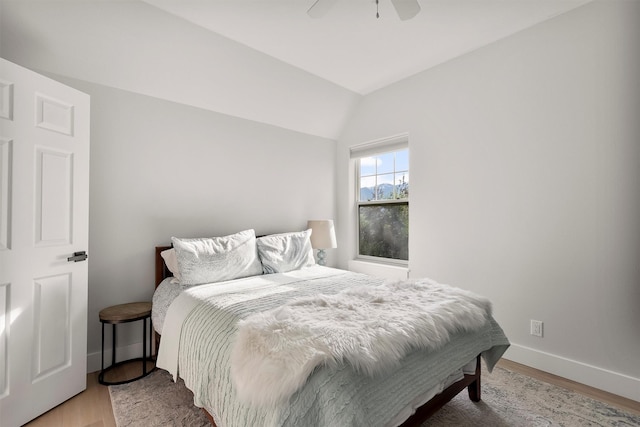 5014 Eastside Hwy, Stevensville, MT 59870 - bedroom with vaulted ceiling, light wood-type flooring, and ceiling fan