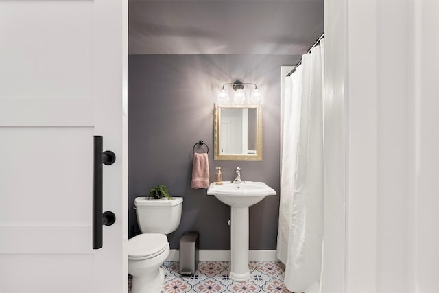 5014 Eastside Hwy, Stevensville, MT 59870 - bathroom featuring toilet and baseboards
