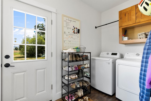 5014 Eastside Hwy, Stevensville, MT 59870 - laundry room with washing machine and clothes dryer, plenty of natural light, and dark wood finished floors