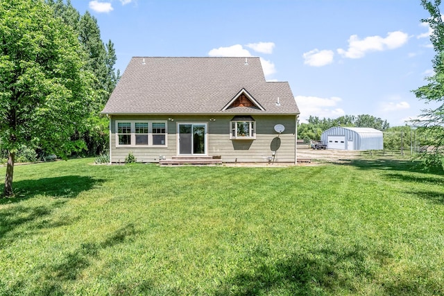 5014 Eastside Hwy, Stevensville, MT 59870 - rear view of house with a lawn and an outdoor structure