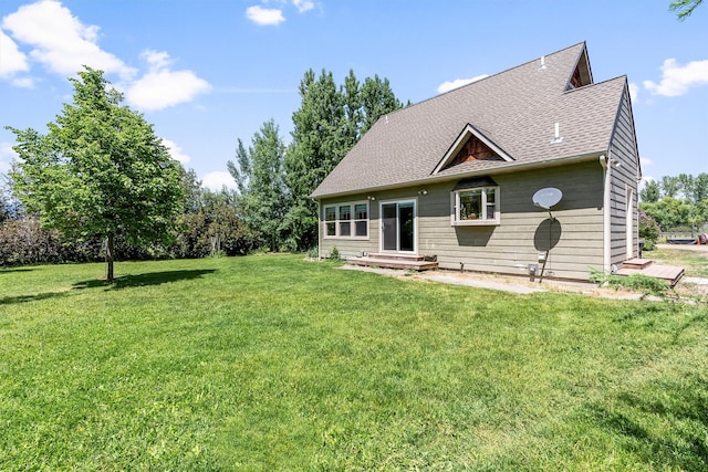 5014 Eastside Hwy, Stevensville, MT 59870 - view of front of house featuring a front yard and roof with shingles
