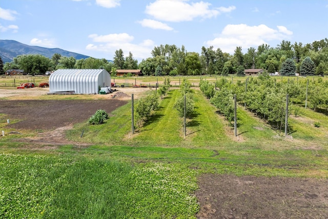 5014 Eastside Hwy, Stevensville, MT 59870 - view of yard featuring a view of rural / pastoral area, an outbuilding, a pole building, and a mountain view