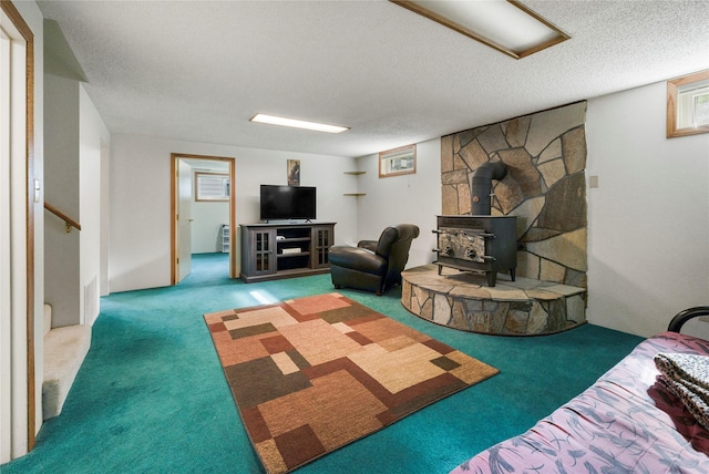 305 S Dell Dr, Havre, MT 59501 - living room with carpet floors, a wood stove, stairs, and a textured ceiling