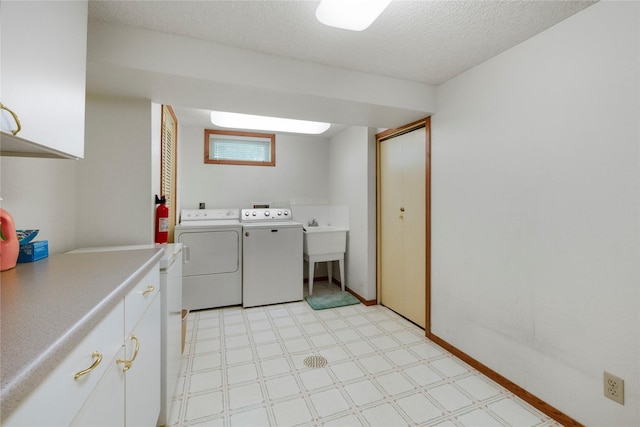 305 S Dell Dr, Havre, MT 59501 - washroom featuring washing machine and dryer, light flooring, a textured ceiling, and cabinet space